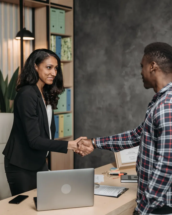 Accountant reviewing figures with a small business client at Brightledger