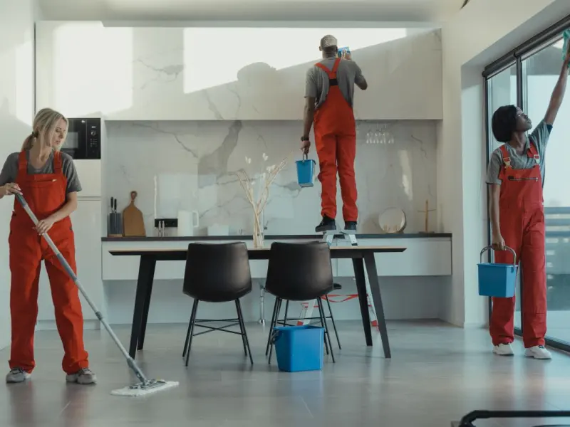 Commercial cleaning crew servicing an open plan office