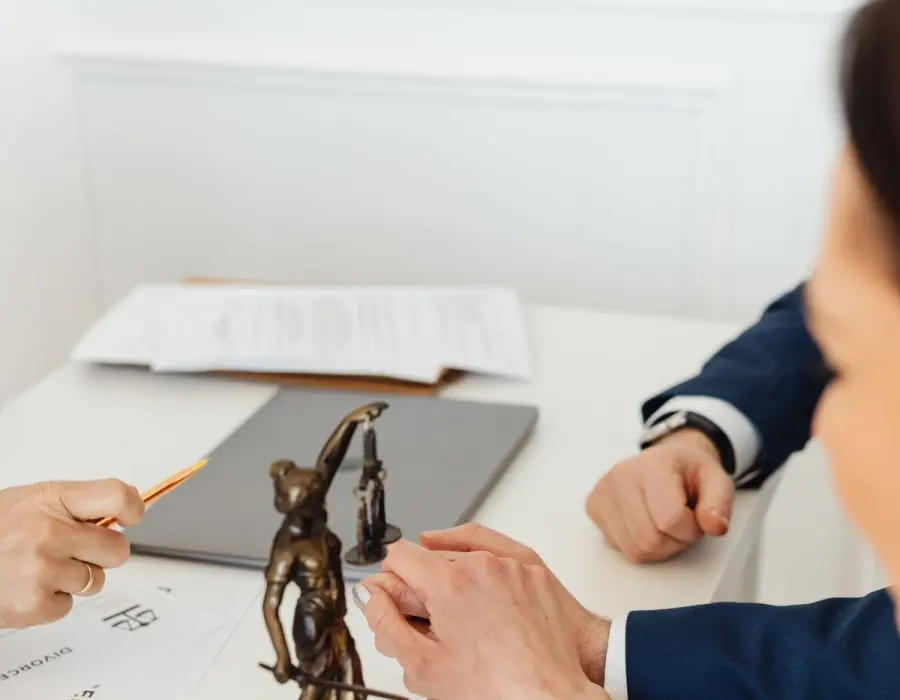 Legal documents and scales of justice during an injury claim review