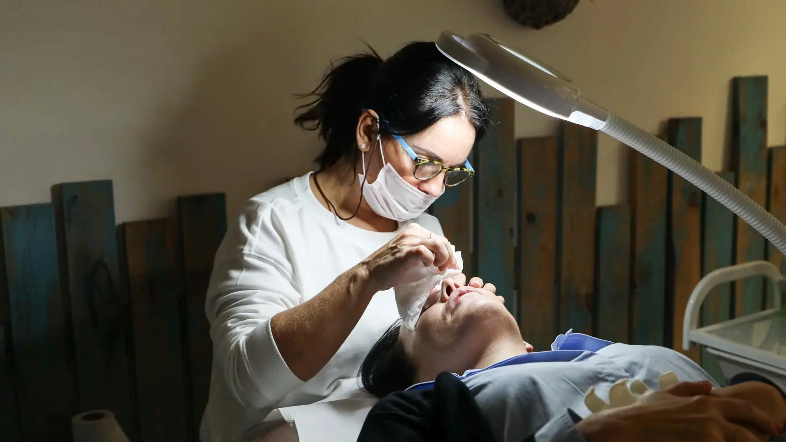 Registered nurse injector performing an aesthetic facial treatment at Lumen Aesthetics Studio