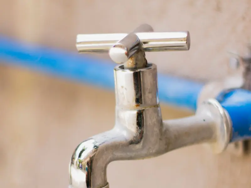 Newly installed chrome faucet and fixtures after a plumbing upgrade