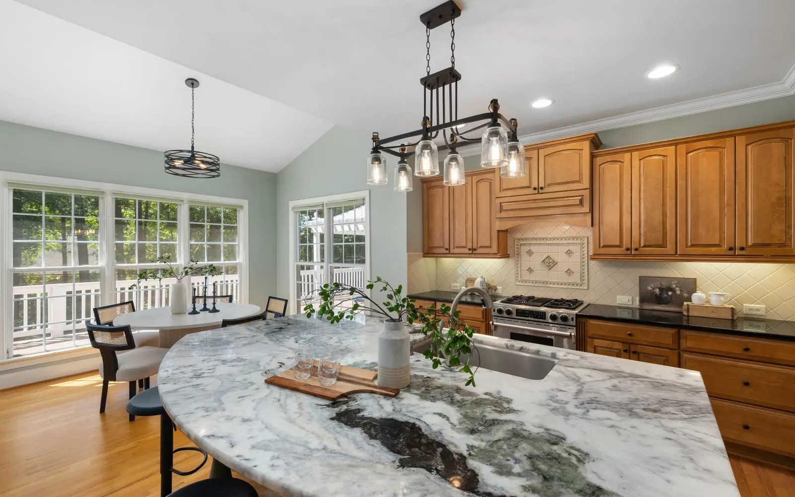 Completed kitchen remodel with marble island and custom cabinetry by Fieldhouse Renovation