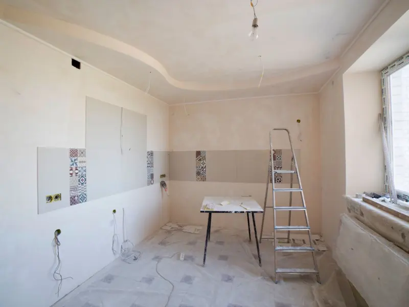 Kitchen renovation in progress with cabinetry being installed